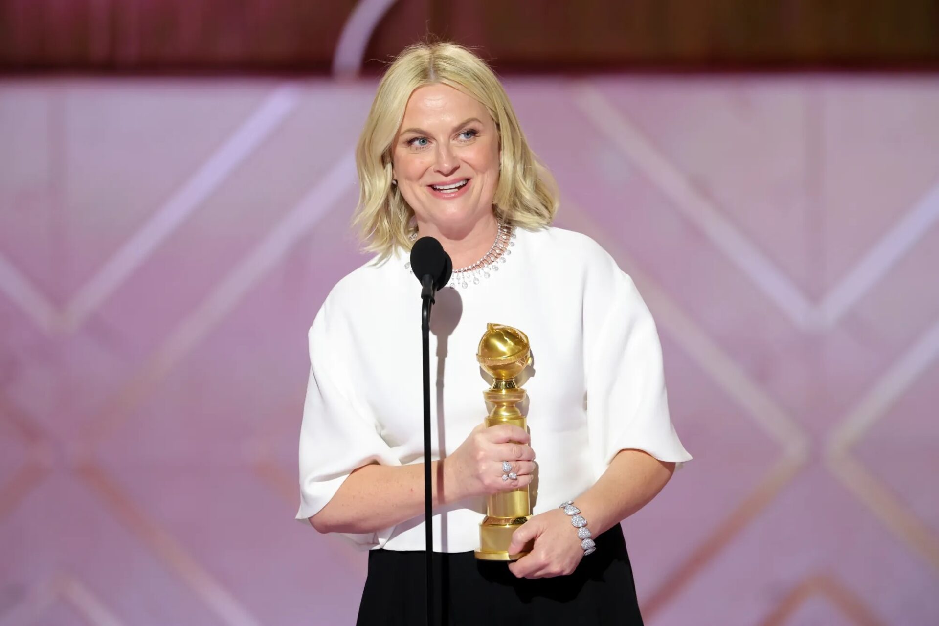 Amy Poehler wins the Podcast Category Award at the 2026 Golden Globes. Photo: Via Golden Globes.